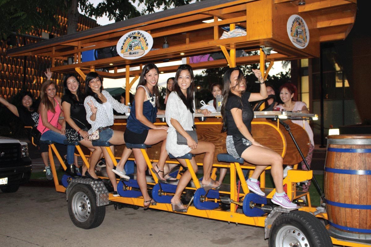 Group on the 15-passenger party bike on the Kaka'ako Bar Tour