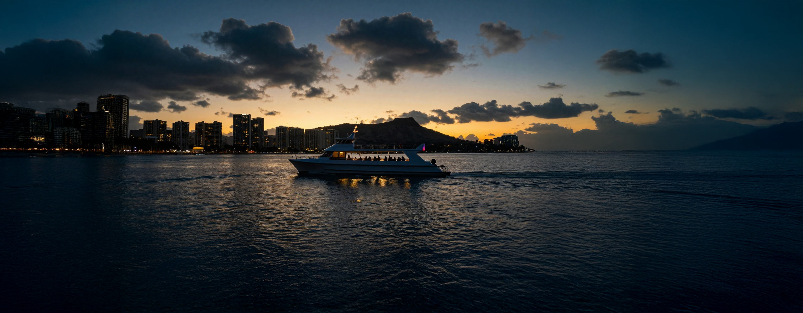 Waikiki sunset cruise sailing past Diamond Head